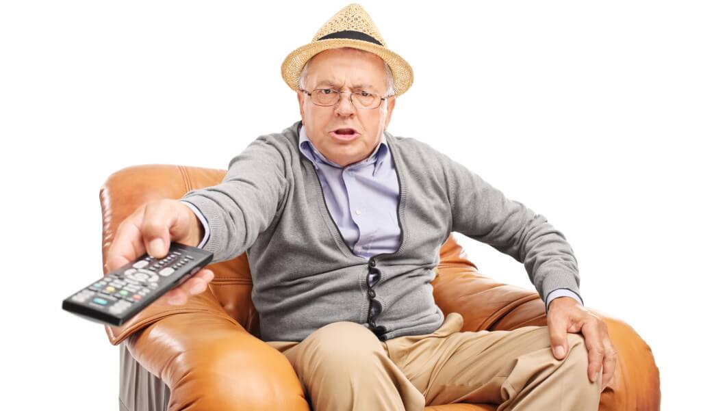 Old man holding remote control