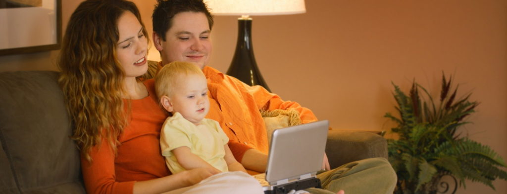 Family watching portable DVD player