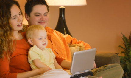 Family watching portable DVD player