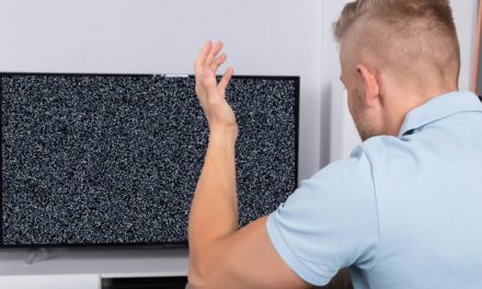 Man in front of TV with no signal