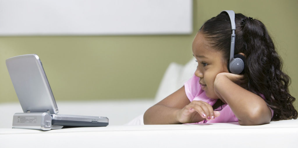 girl watching portable blu ray player 1200