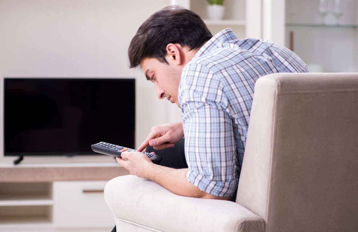 Man with tv remote