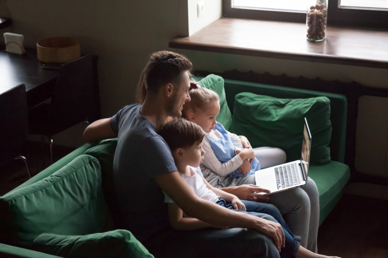 family watching video on laptop