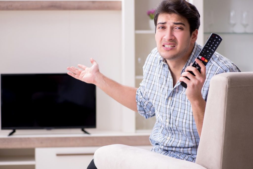 Man with tv remote confused 1200