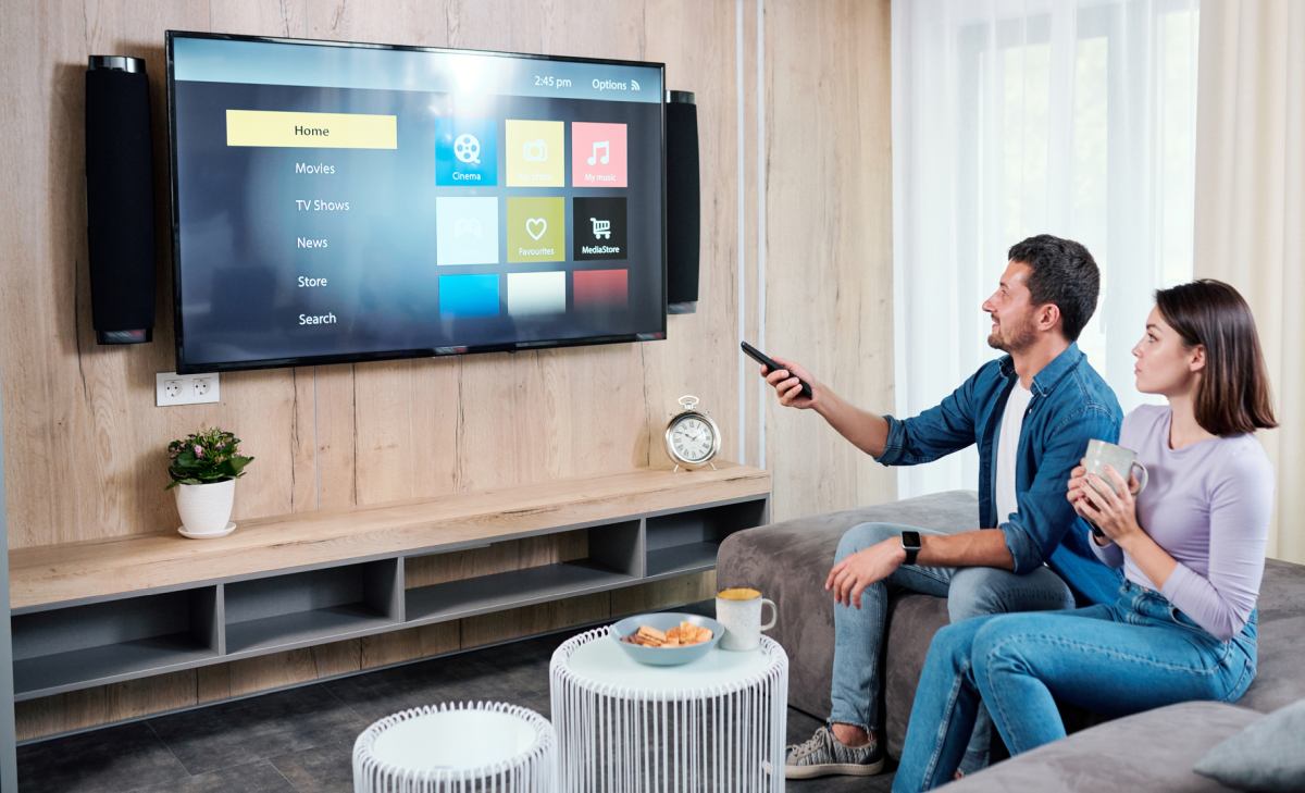 Couple watching smart tv Couple watching smart tv