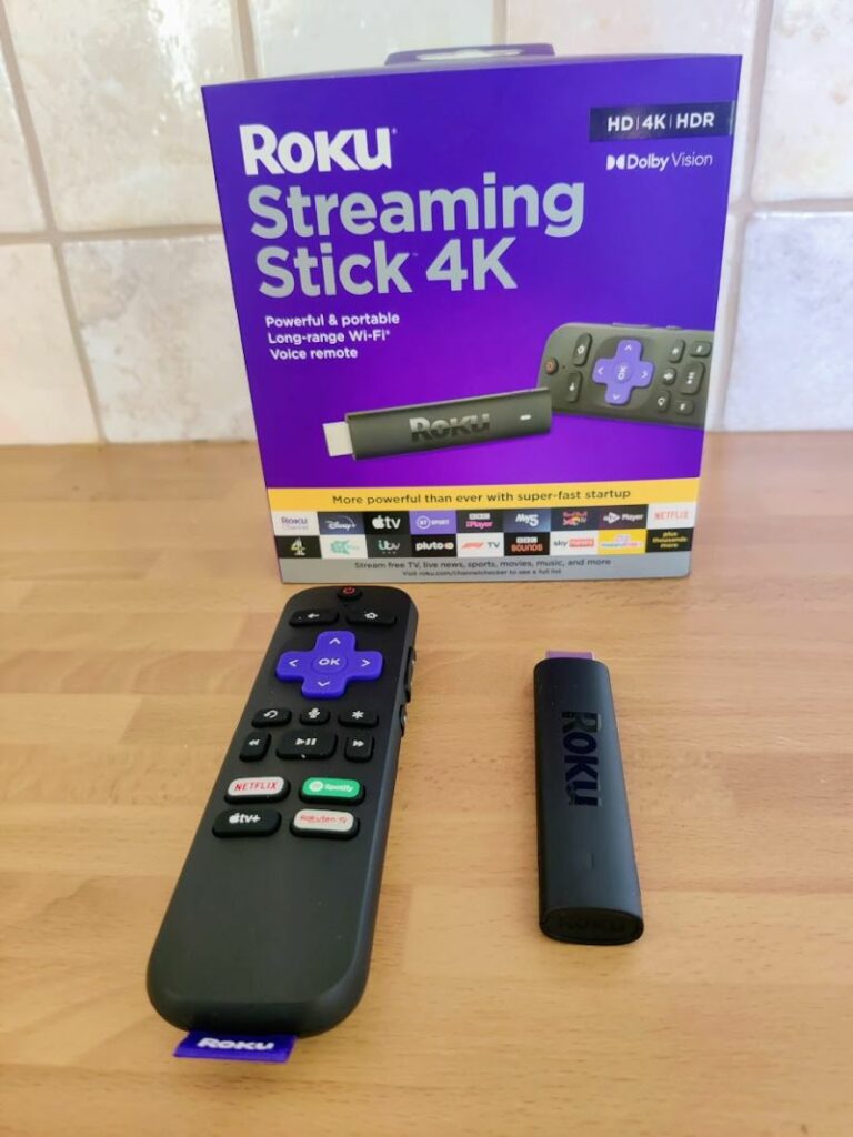 Roku Streaming Stick 4K and remote near box