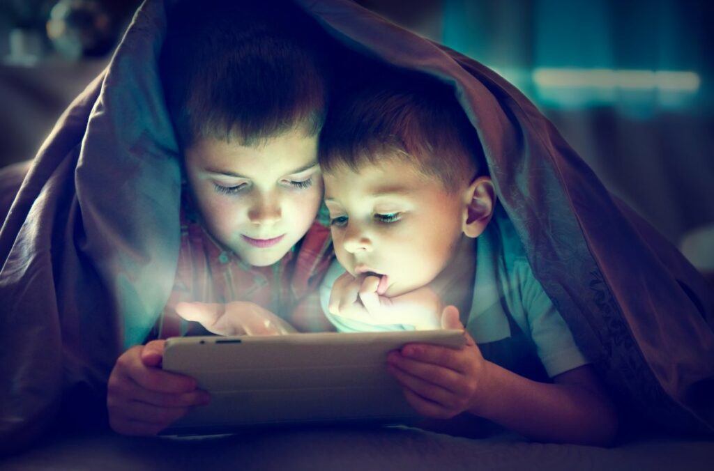 Two children using tablet