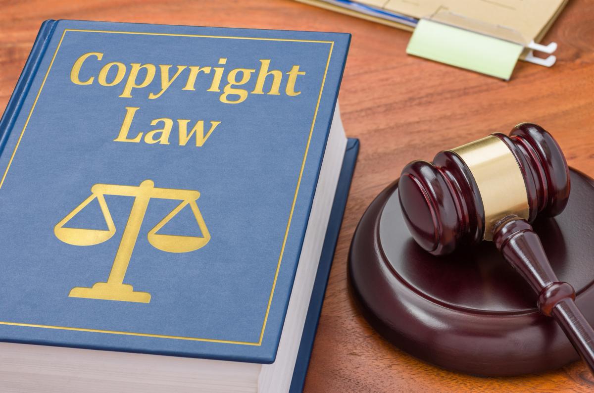 Copyright law book with court gavel