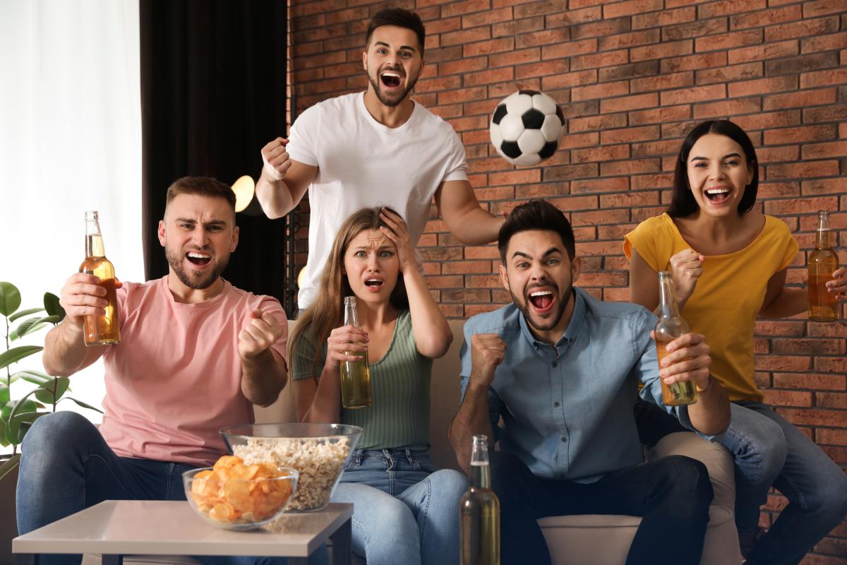 Friends watching football excited