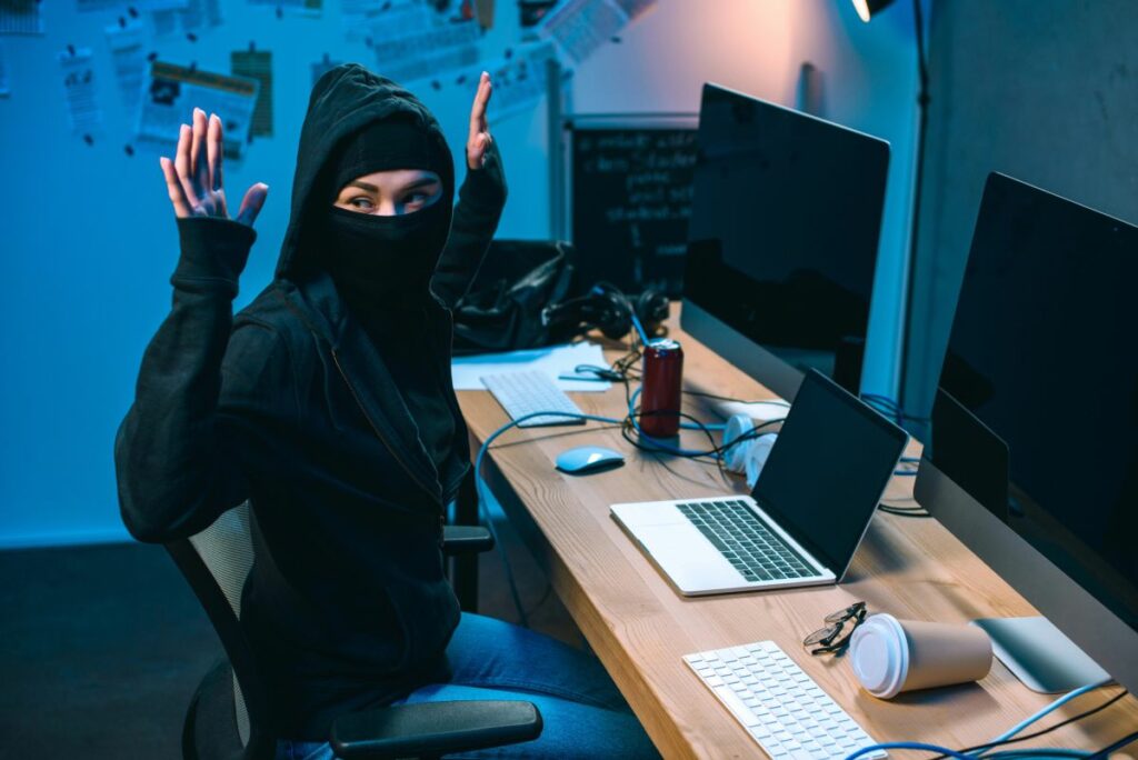 Hacker arrested hands up