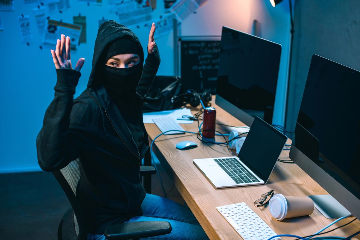 Hacker arrested hands up