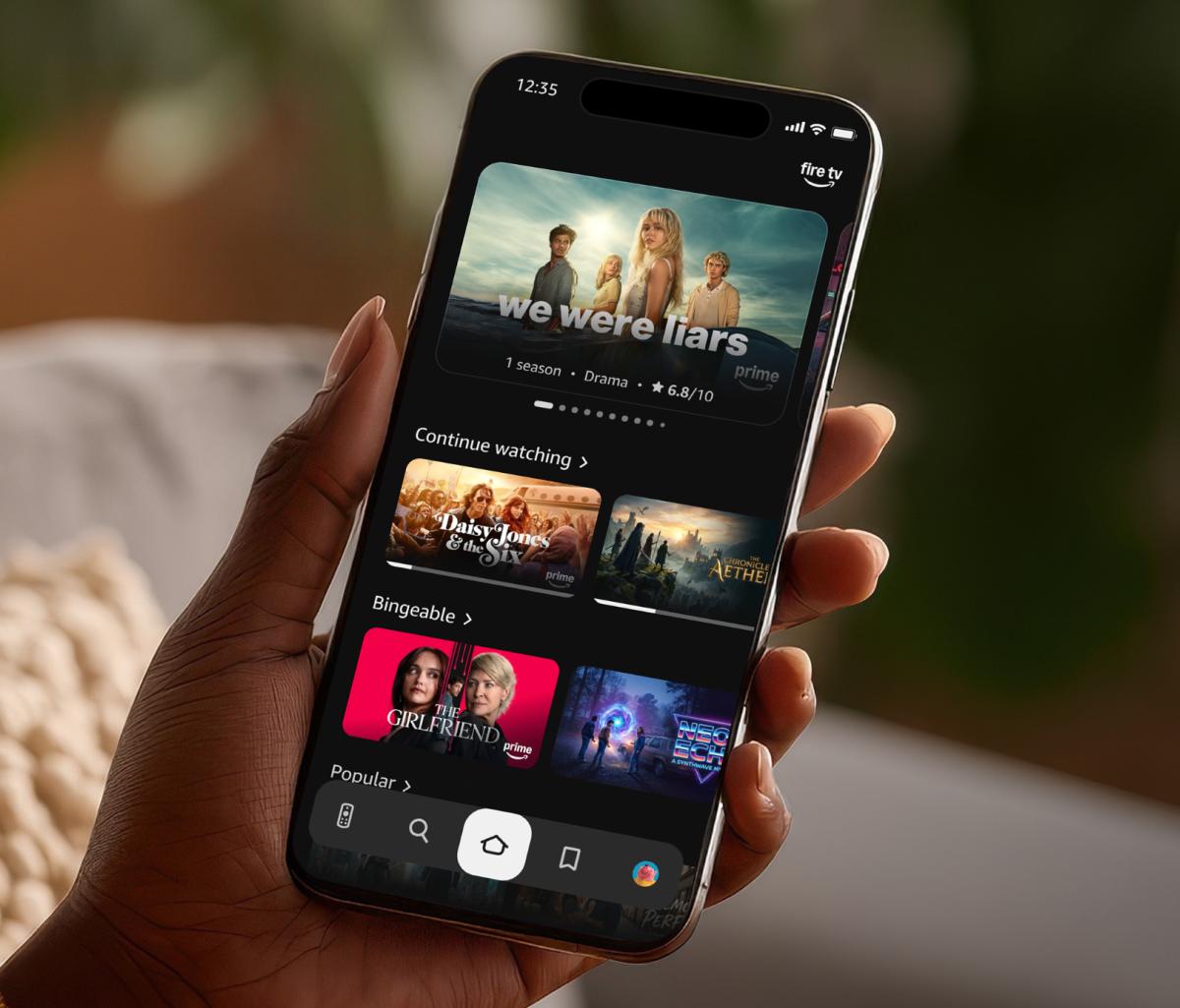 Fire TV Mobile app in hand Fire TV Mobile app in hand